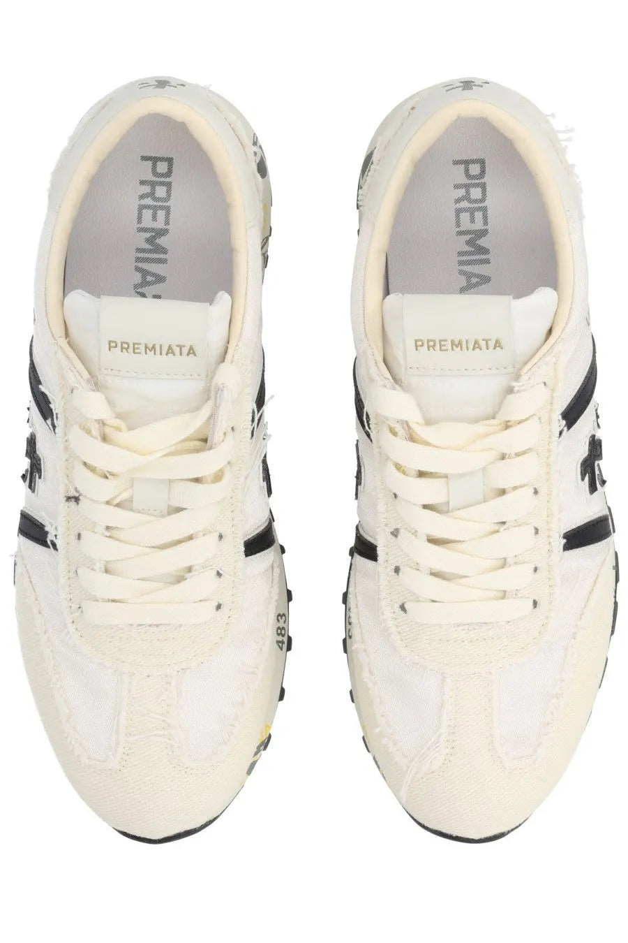Cream-colored Premiata women’s sneaker Lucy White with black accents and distressed vintage-inspired leather design