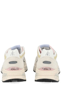 Cream-colored Premiata women’s sneaker mased white with subtle pink and yellow accents and textured rubber sole