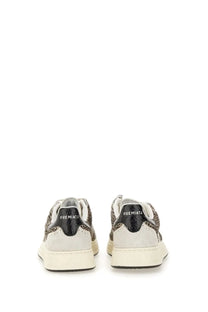 Premiata women’s sneaker Quinnd pattern with black and gray textured snake skin and white suede accents on off white sole