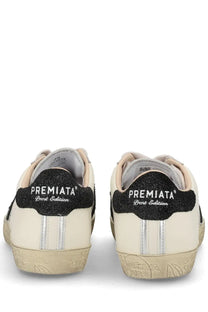 Premiata women’s sneaker stevend white cream color with black glitter heel tabs and silver side stripes