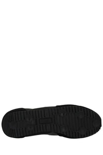 Black rubber sole with textured tread and small rectangular logo on pro-keds men’s reacer sneaker black back side