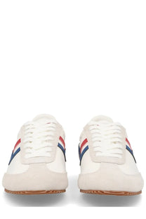 Pro-keds men’s reacer white sneakers with red white and blue striped accents on the sides showcasing classic design