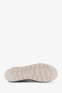Cream-colored rubber sole with textured blocky tread and black sidewall detailing on pro-keds men’s royal intrepid canvas sneakers white