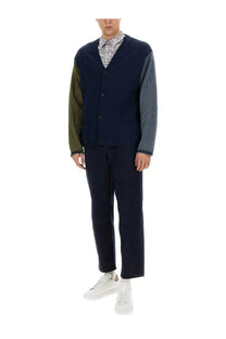 Navy blue ribbed knit cardigan with contrasting olive and striped sleeves paired with ps by paul smith men’s cotton blue pants