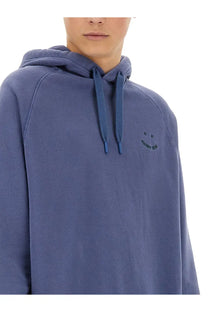 Ps by Paul Smith men’s happy hoodie in soft blue with matching drawstrings and embroidered smiley face on the chest