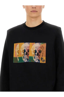 Ps By Paul Smith men’s black long-sleeved sweatshirt with vibrant triptych skull graphic on orange and green background