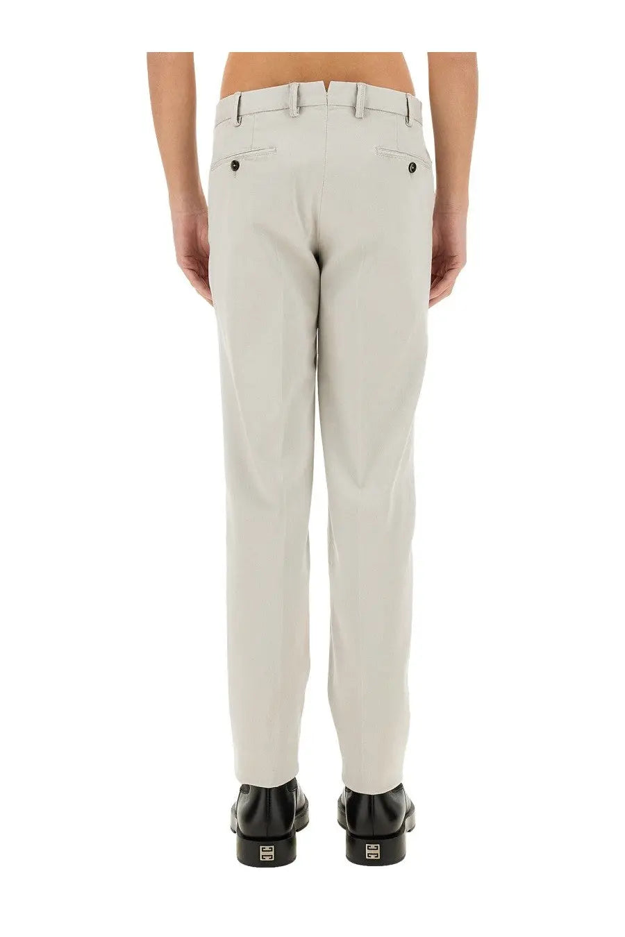 Beige cotton pt torino men’s chinos with tailored fit and black buttoned back pockets shown from the back side