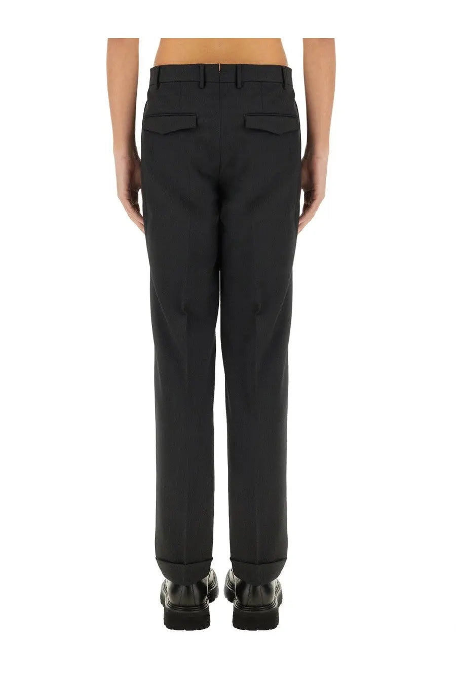 Black tailored pt torino men’s straight leg trousers with sleek cut and subtle back pleats visible from the back side