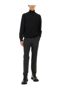 Black turtleneck sweater with a smooth fitted silhouette paired with pt torino men’s grey straight leg pants