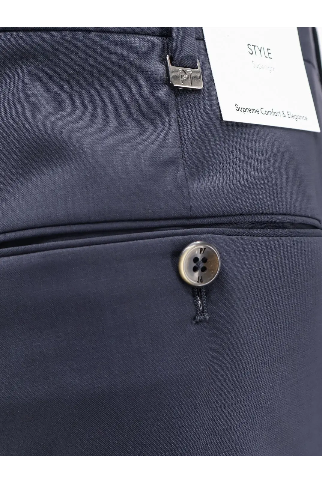 Dark navy blue tailored pt torino men’s virgin wool trousers with subtle woven texture metallic button and branded tag