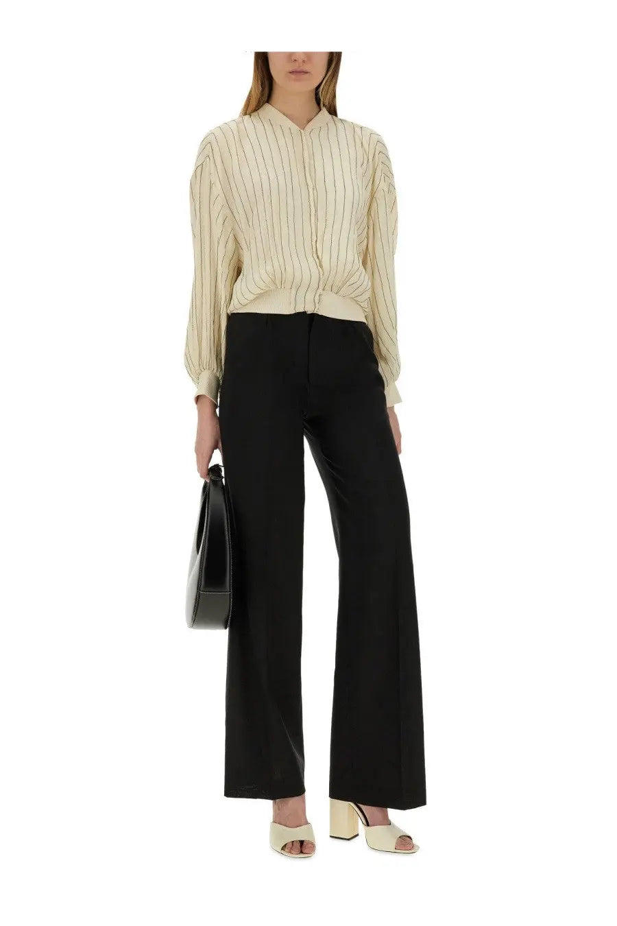 Cream-colored blouse with vertical black stripes and subtle texture paired with pt torino women’s pantalone lola black
