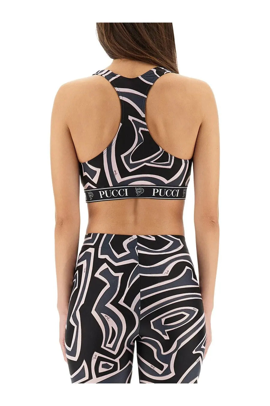 Black and white abstract patterned pucci sports bra with racerback design shown from the back for activewear use