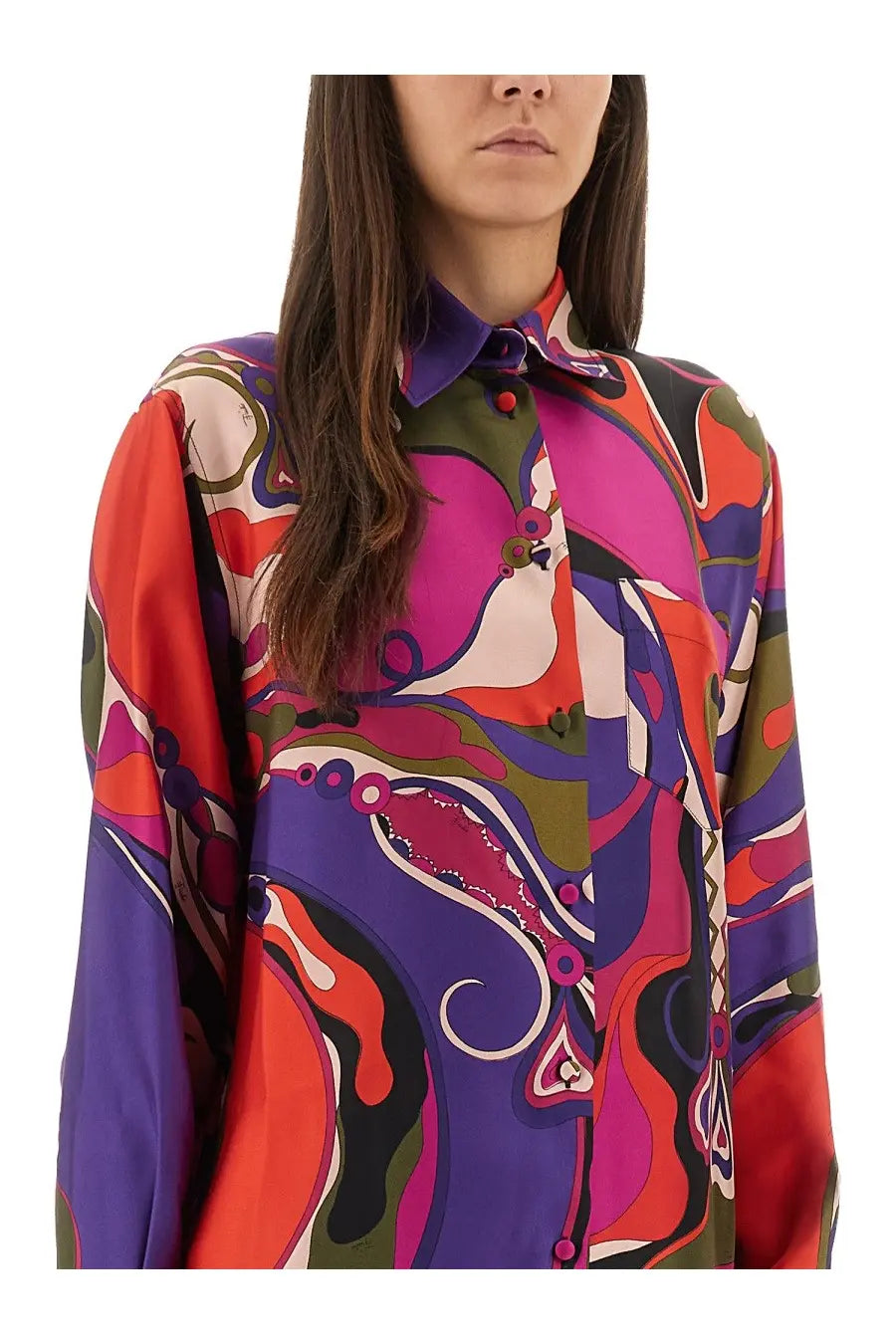 Pucci women’s orchid print shirt is a vibrant long-sleeved silk blouse with a psychedelic abstract multicolor pattern