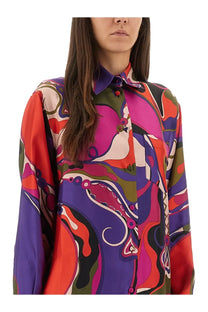 Pucci women’s orchid print shirt is a vibrant long-sleeved silk blouse with a psychedelic abstract multicolor pattern