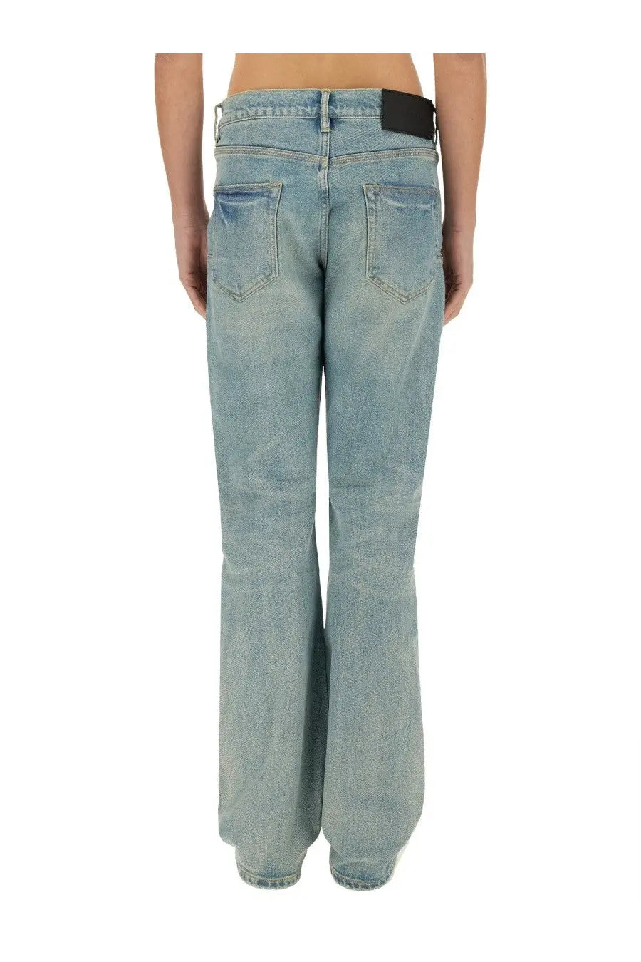 Purple Brand men’s coated flare jeans in light-wash denim with black leather belt loop at waistband in blue
