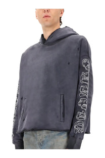 Dark gray distressed purple brand men’s hoodie with white gothic lettering along the sleeves showing front side