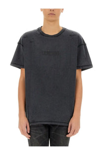 Black distressed cotton t-shirt with subtle embroidered logo across the chest from purple brand mens inside out shirt black