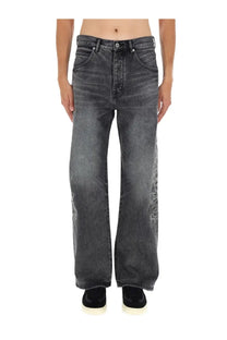 Purple Brand men’s wide-leg dark gray denim pants with subtle white embroidered designs and gothic wordmark detailing