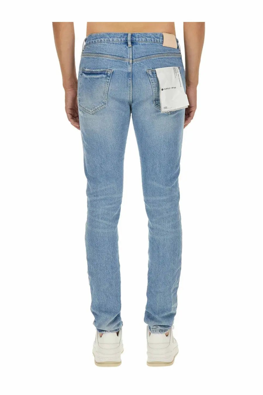 Purple Brand men’s vintage abrasions slim fit light-wash denim jeans with subtle fading and beige label at waistband