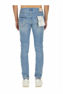 Purple Brand men’s vintage abrasions slim fit light-wash denim jeans with subtle fading and beige label at waistband
