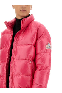 Vibrant pink unisex Pyrenex down puffer jacket with quilted design and triangular logo patch on sleeve