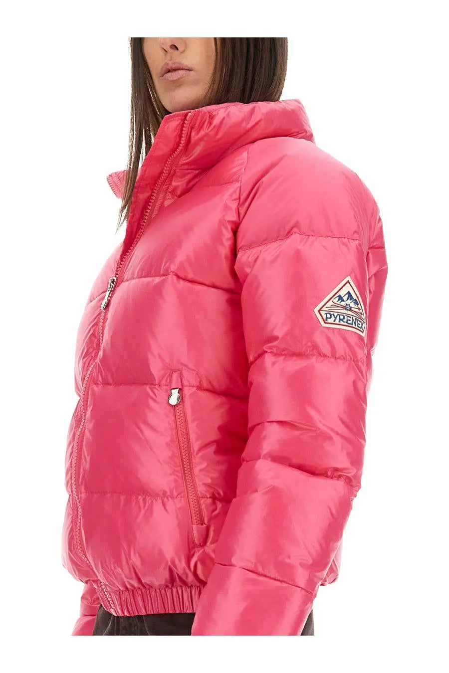A vibrant pink Pyrenex unisex down jacket with quilted design and branded sleeve patch in vintage mythic blue style