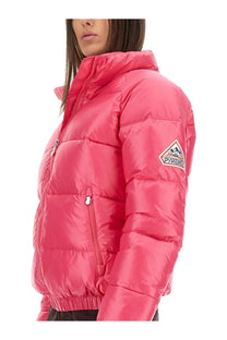 A vibrant pink Pyrenex unisex down jacket with quilted design and branded sleeve patch in vintage mythic blue style