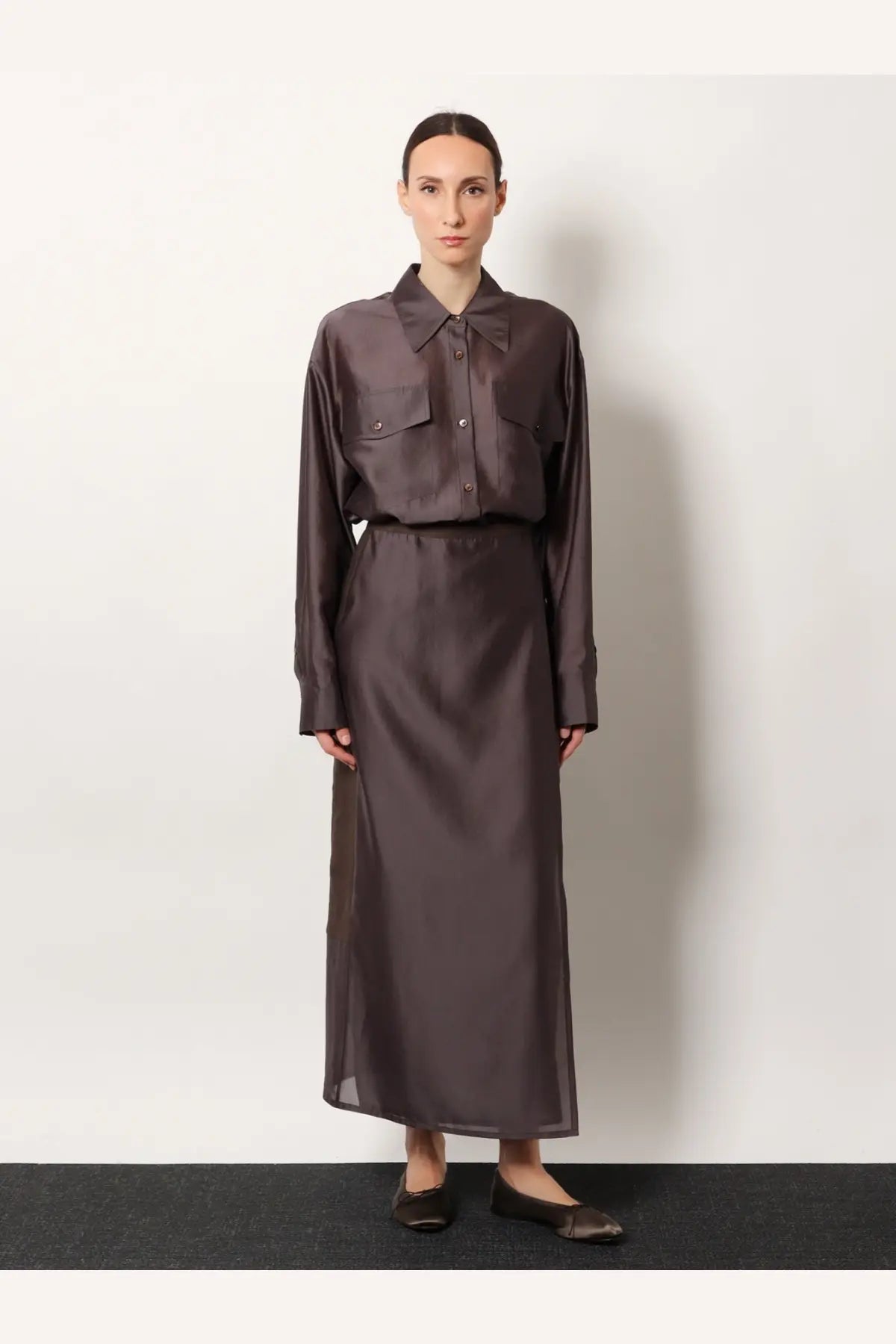 R2W women’s amora linen skirt brown with a sleek dark brown satin button-up shirt and high-waisted midi skirt set