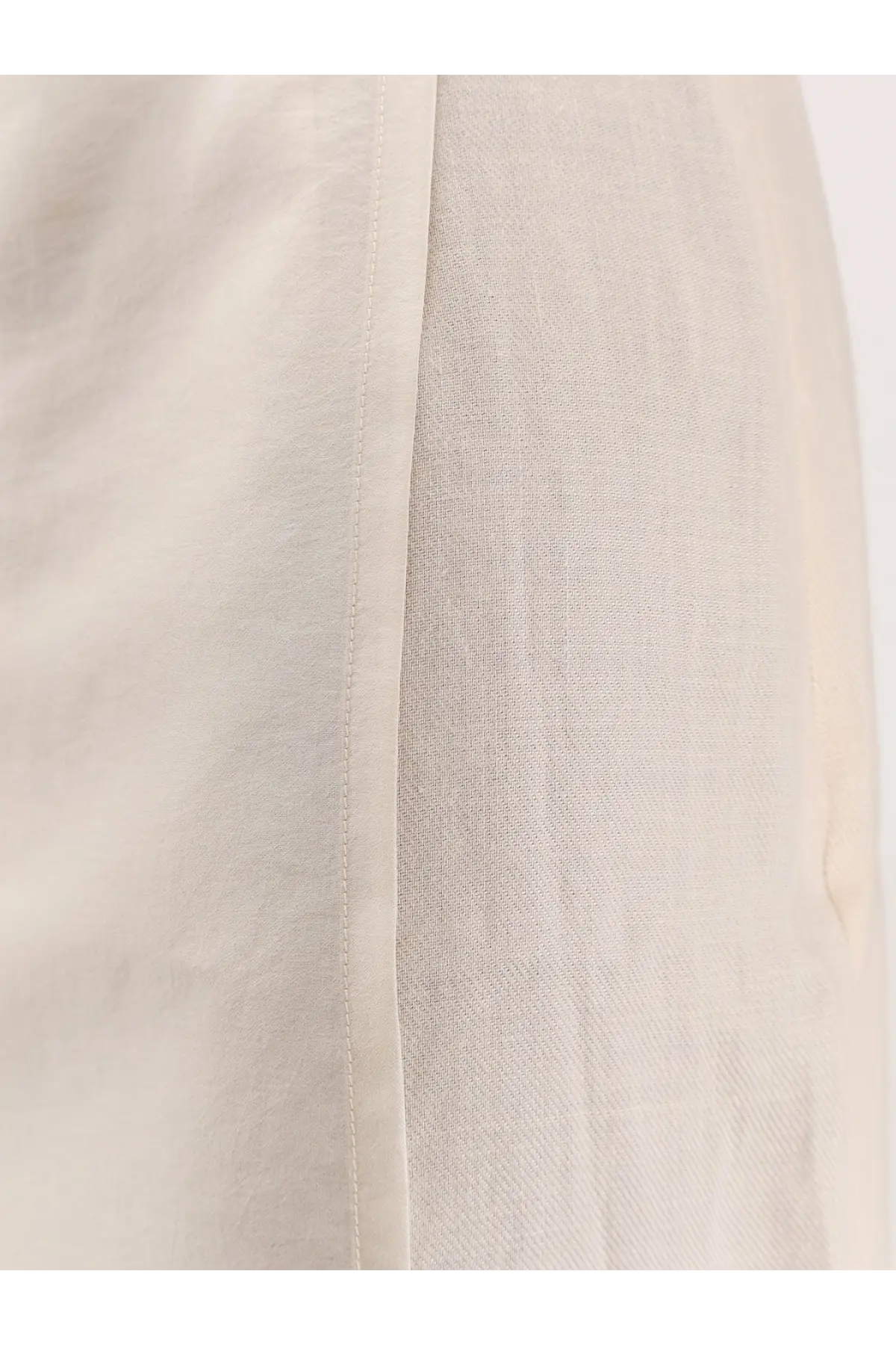 Beige linen skirt with subtle textured weave and clean straight seam from r2w women’s amora linen skirt white collection