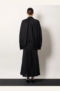 Black oversized bomber jacket with relaxed fit and subtle back pleats made of wool and silk by R2W women