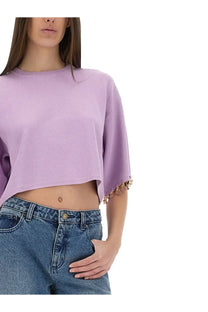 Lavender rabanne women’s knit crop shirt featuring gold heart-shaped charms on sleeve cuffs in purple knit fabric