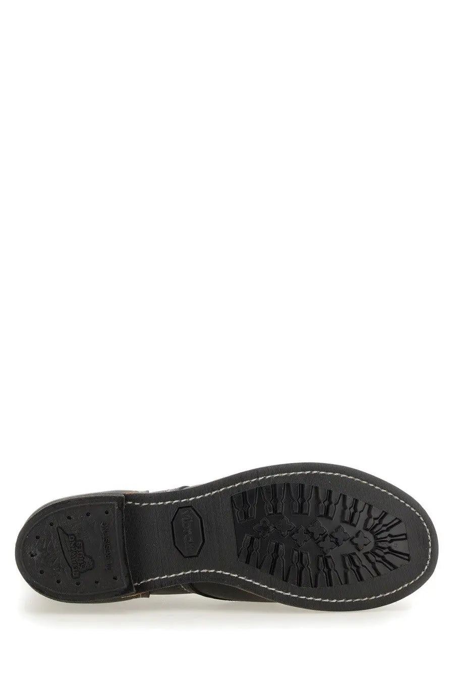 Black rubber sole with white stitching and textured tread on red wing men’s stivale iron ranger black boot