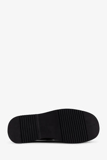 Black rubber sole with a textured ribbed pattern on the back side of reference mens the canoa resort suede sabot black
