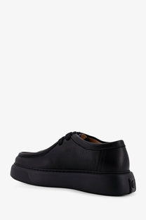 Black leather lace-up men’s shoe with thick platform sole from reference fernabee collection