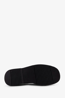 Black rubber sole with textured ribbed pattern on the back of reference men’s the tahoe resort suede lace beige shoe