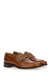Rene Caovilla women’s beige leather loafers with a decorative beaded snake design across the front
