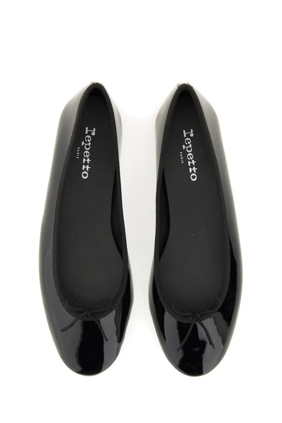 Repetto women’s ballerina Lili black patent leather flats with classic bow and iepetto Paris branding on the insole