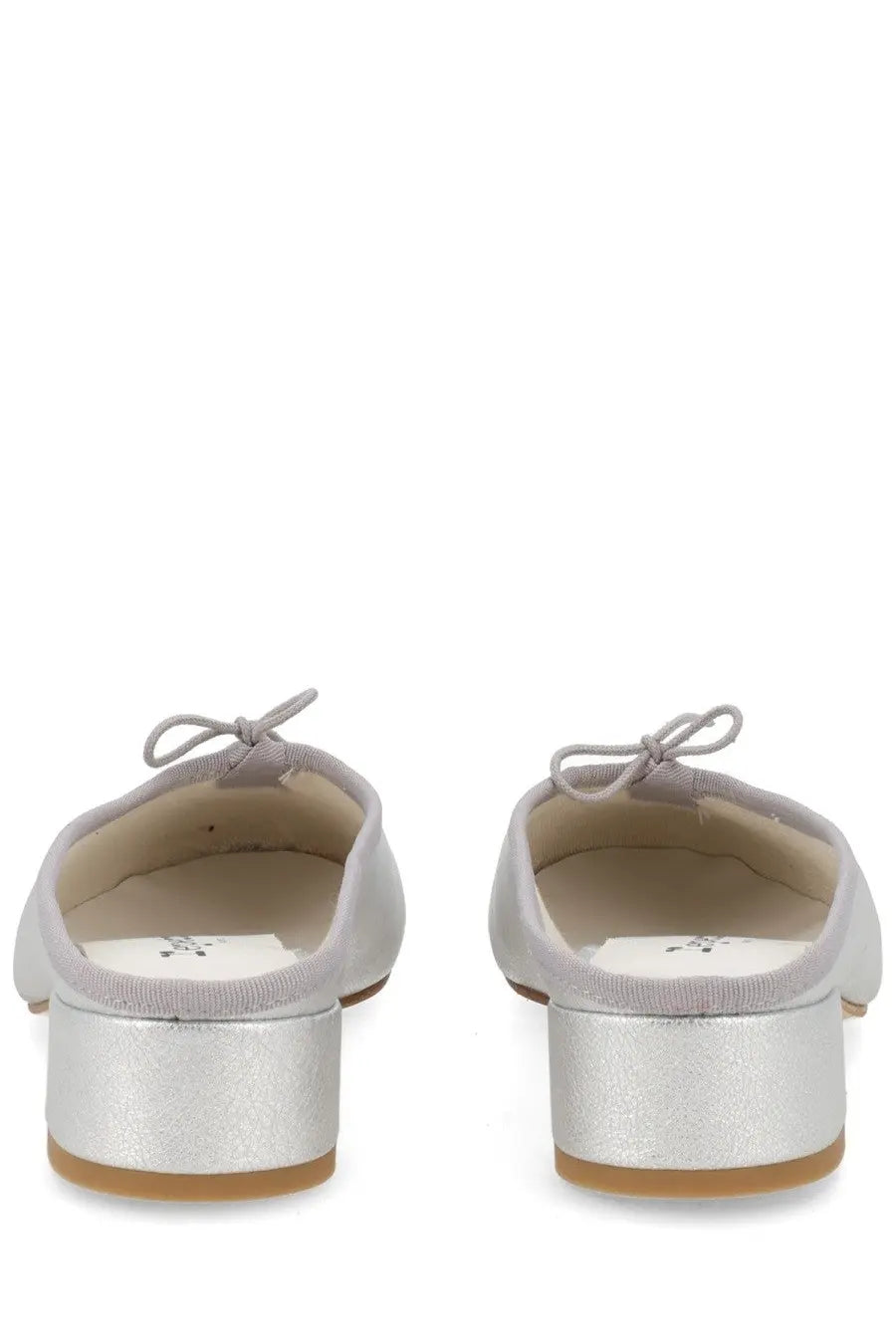 Back view of repetto women’s ballerina mule camille silver metallic flats with bow detail at the heel