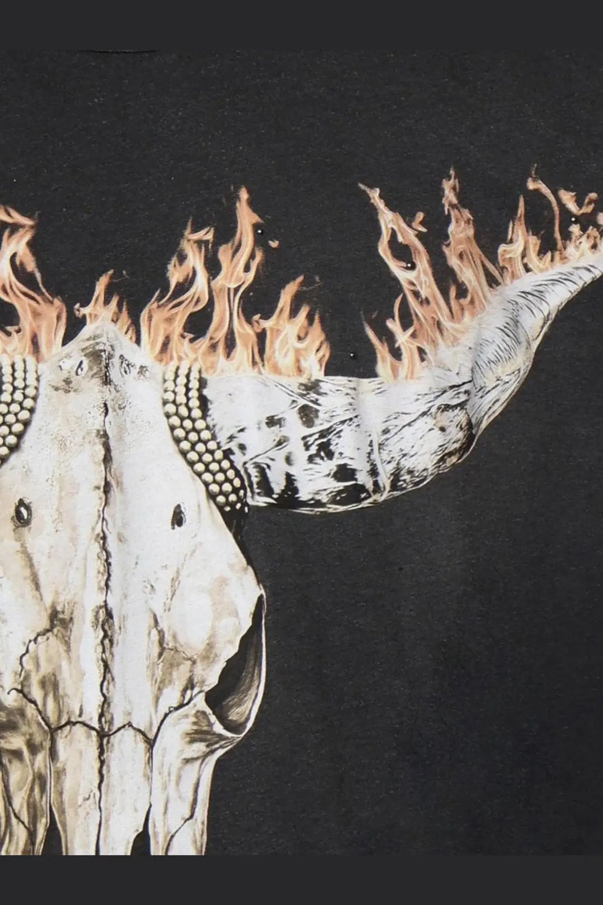 Black cotton represent men’s british cowboys t-shirt with a white bull skull graphic and flames on the front