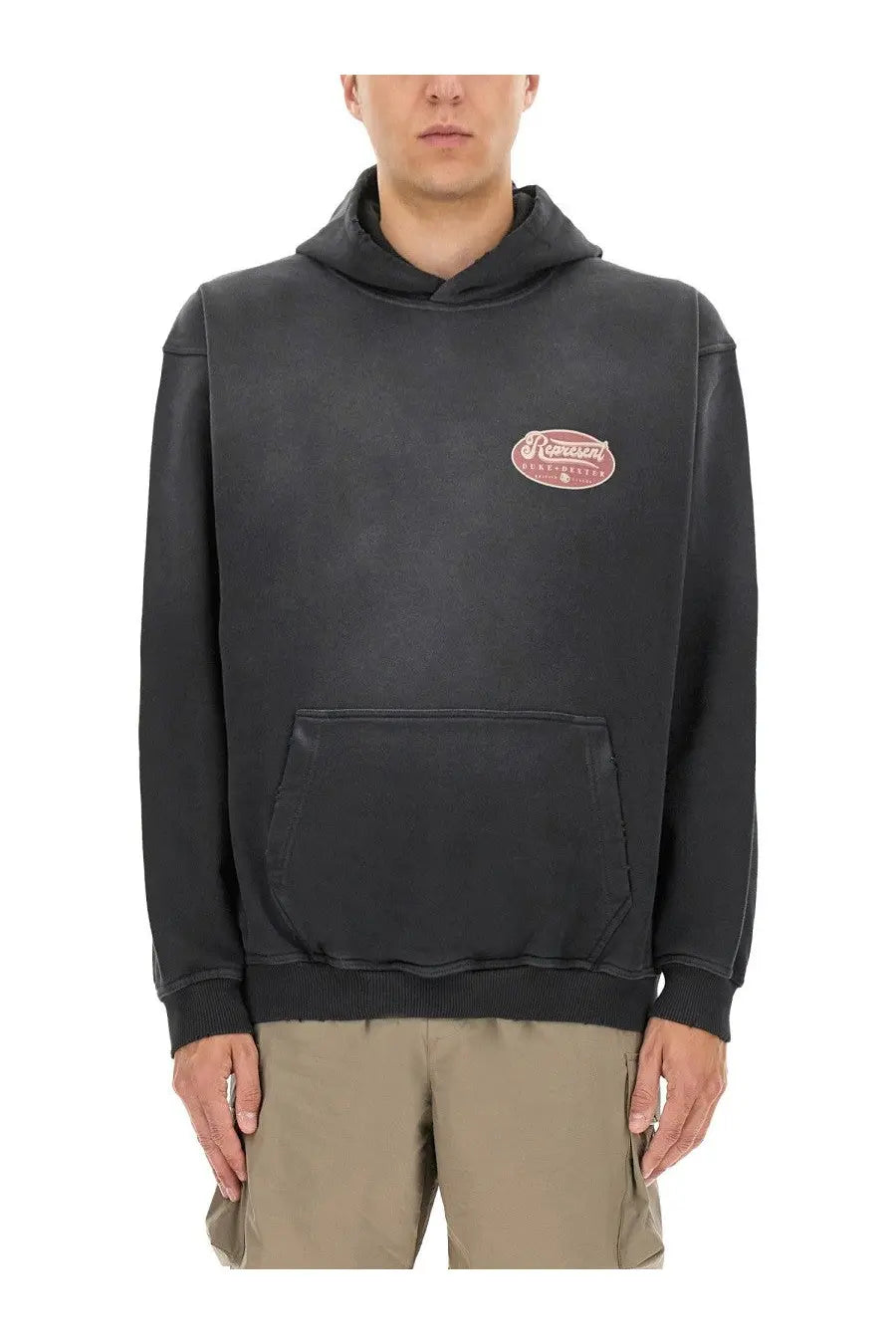 Black oversized represent men’s british luxury sweatshirt with faded pink oval logo and ribbed cuffs and hem