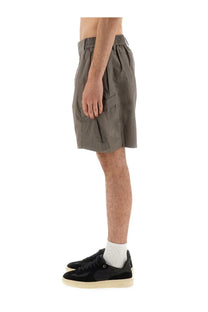 Olive green represent men’s cargo tech shorts with elastic waistband and side pockets for casual wear
