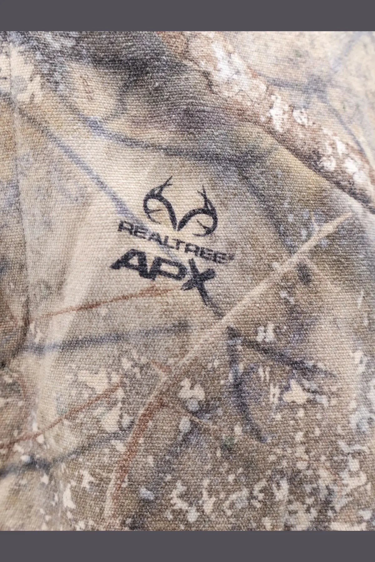 Represent men’s cargo trousers green in Realtree apx camouflage fabric with detailed woodland pattern in earthy browns tans and grays