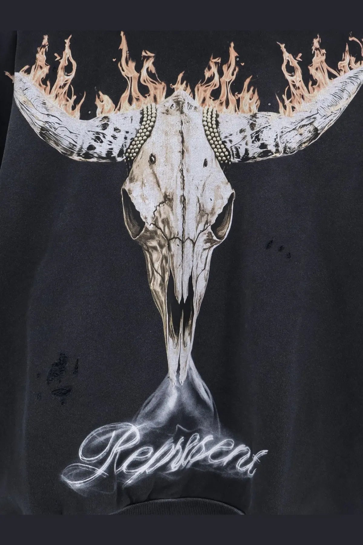 Black cotton sweatshirt featuring a detailed flaming bull skull graphic with spiked horns and reps in white cursive