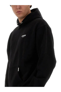 Represent men’s hoodie black with a small white chest logo and silver zipper pulls in a hooded sweatshirt design