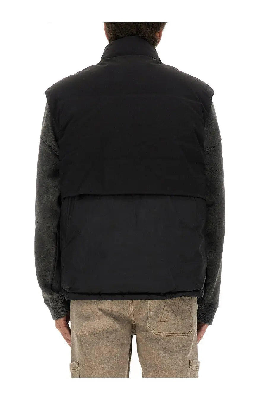 Back side of represent men’s black padded vest with contrasting dark gray sleeves and subtle lower back logo