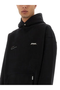 Black represent men’s patron of the club hoodie with white embroidered logo and signature on the chest