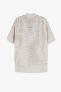 Cream-colored short-sleeved knit cardigan with textured openwork pattern paired with represent men’s pico cotton blend polo shirt white