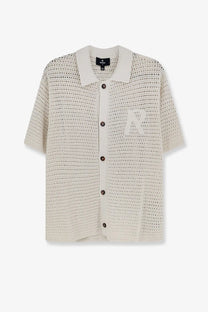 Off-white represent men’s pico cotton blend polo shirt with subtle textured pattern and small embroidered chest logo