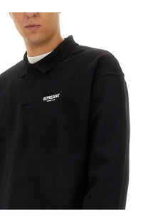 Represent men’s polo black long-sleeved shirt with subtle white embroidered represent logo on the chest