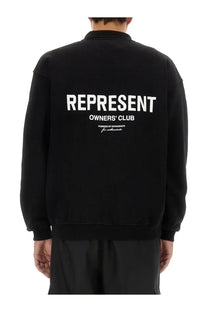 Back side of black oversized bomber jacket with bold white represent owners club lettering for men by represent